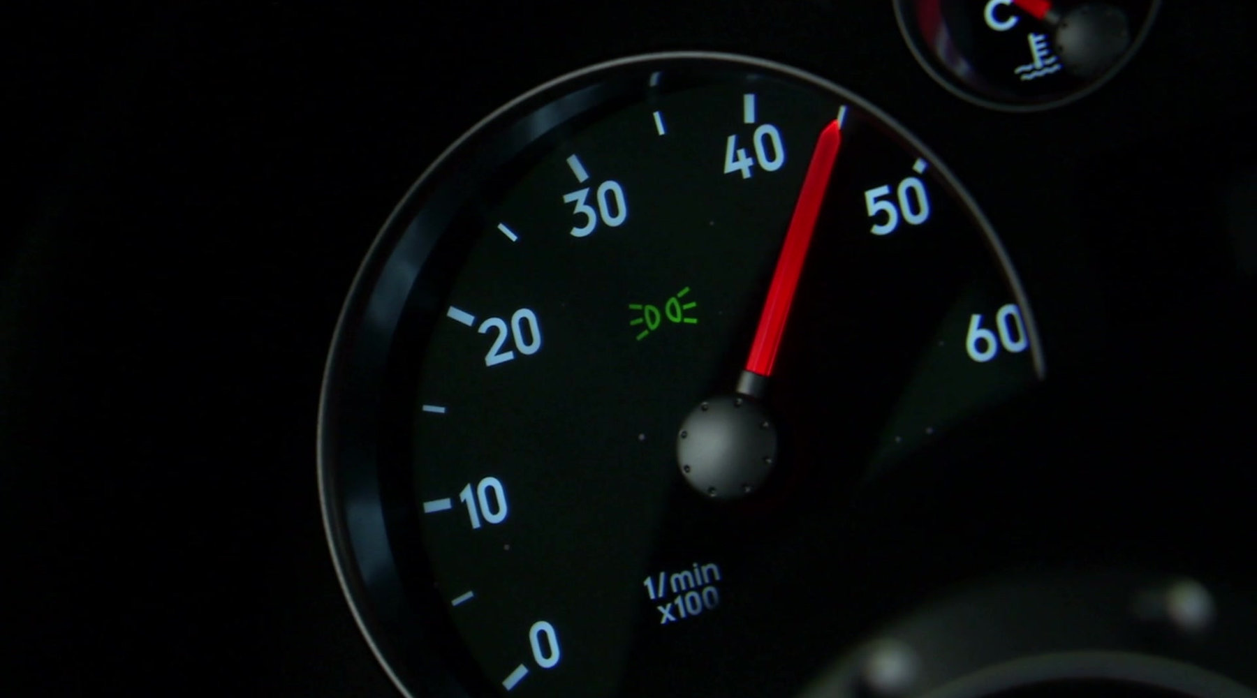 Illuminated rev counter on a vehicle dashboard